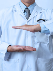 Doctor, medical professional holding something in empty hand