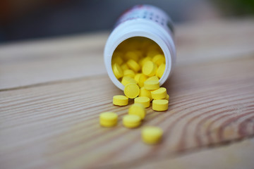 Yellow pills placed on the table