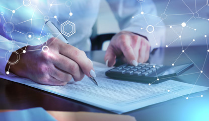 Woman doing her accounting; light effect