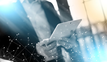 Businessman with tablet; light effect