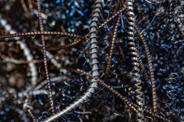 Close-up of twisted spiral steel shavings. Abstract background