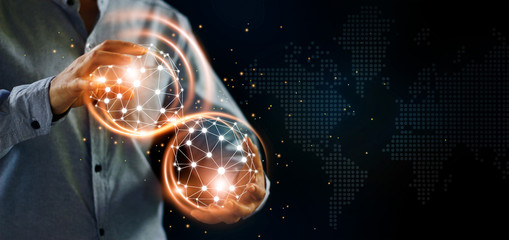 Man and abstract global networking connection in hands. Technology and internet communication. Data...