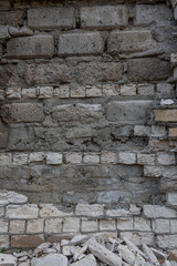 Brick wall with destroyed masonry