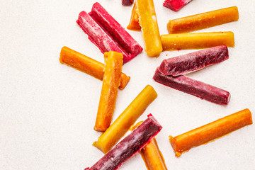Frozen assortment of fruit purees in the form of sticks