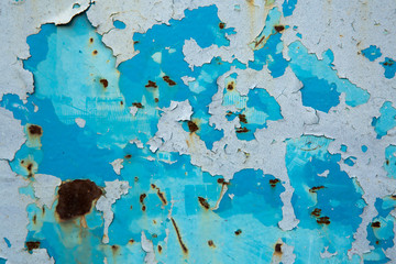 The rusted surface with peeling paint. Abstract background