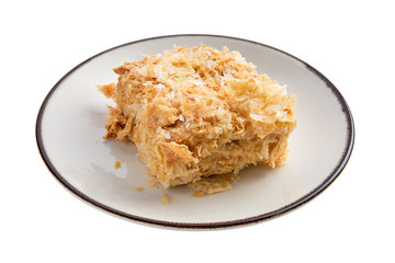 Napoleon cake on plate isolated on white