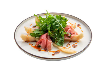 Salad with jamon, pear and arugula isolated on white