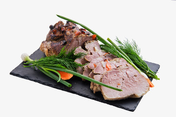 Baked ham decorated with fresh vegetables isolated on white