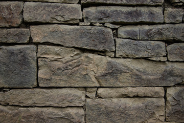 Natural old stones wall background brown color