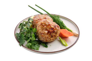 Meatballs served with fresh carrot, spring onion and parsey