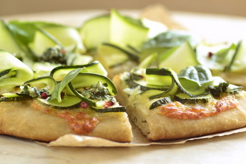 Vegetarian pizza with zucchini, mozzarella and basil