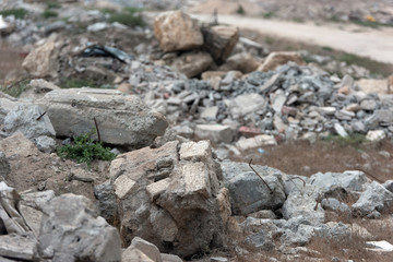 A pile of construction waste in a landfill. Selective focus
