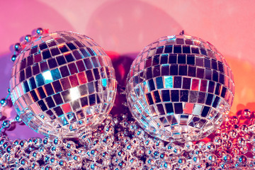 disco ball bauble on pink background.  party concept