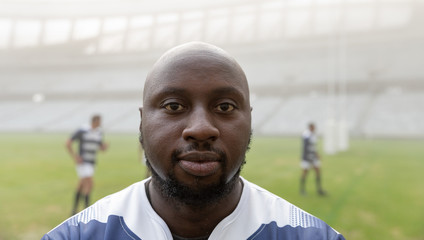  African american male rugby player standing in stadium