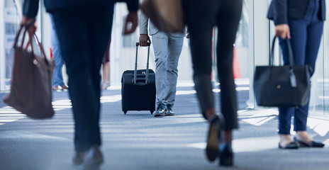 Business people walking in corridor in modern office