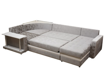 Modern multifunctional classic grey sofa with stand and cushions, isolated white background. Furniture, interior, stylish sofa