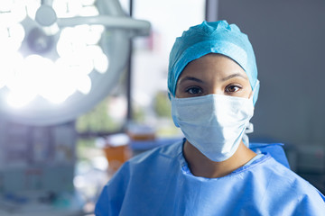 Fototapeta na wymiar Female surgeon standing in operation room at hospital