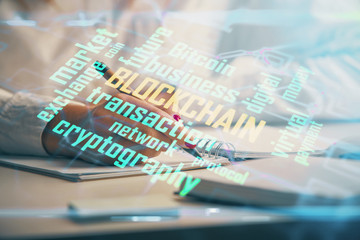 Cryptocurrency hologram over woman's hands writing background. Concept of blockchain. Double exposure