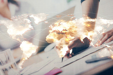 International business hologram over hands taking notes background. Concept of success. Multi exposure