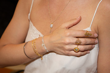 woman hands with boho gypsy silver accessories rings and bracelets