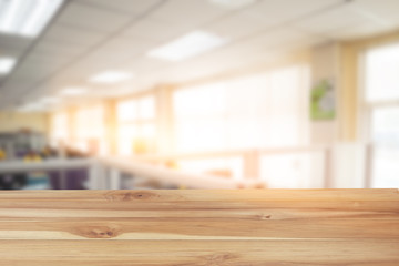 Empty table and abstract office room blurred in the workplace with work space of table work in office.