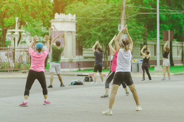 Group of elderly friend doing aerobic dance after work   together at Lumpini Park in Bangkok, Thailand.