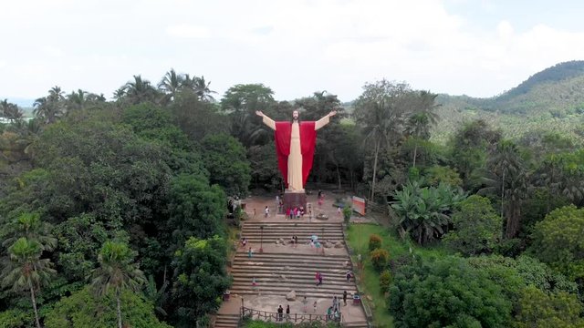 Aerial drone footage of beautiful salute Jesus at Kamay ni Hesus healing Catholic church.