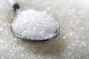 Closeup of spoon with white sugar