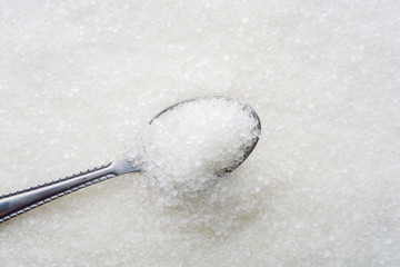 Closeup of spoon with white sugar