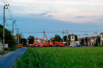 Fototapeta premium Bangkok, Thailand July 29,2019 :Electricity employees are repairing high voltage wires