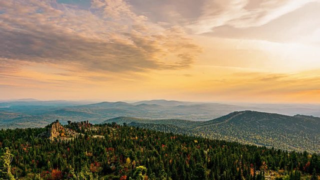 Panorama of a mountain valley in autumn at sunset view from the top. 4k time-lapse
