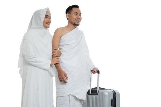 muslim couples wife and husband wearing white traditional clothes for Ihram ready for Hajj