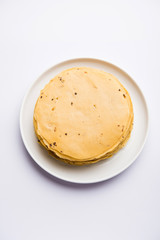 Gujarati papad or papadum in raw dried form with roasted cone, roll and flat variation