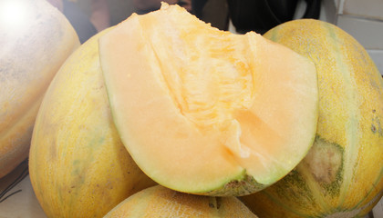 Melon, honey melon. Melons background texture. Fresh organic yellow fruits. Vegetarian or healthy eating concept.