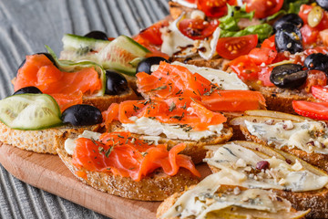 Assorted bruschetta Set of various appetizing snacks sandwiches