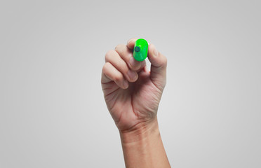 Hand holding marker pen for writing