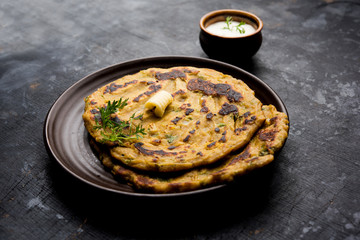 Thalipeeth is a type of savoury multi-grain pancake popular in Maharashtra, India served with curd/butter or ghee