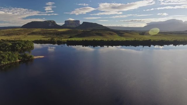 Aerial view of Canaima National Park tepuis: Kurun, Kusary and Kurawaik.  Venezuela. Canaima is visited for tourist all around the world.