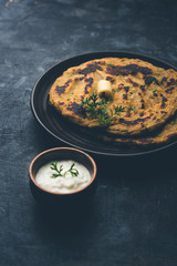 Thalipeeth is a type of savoury multi-grain pancake popular in Maharashtra, India served with curd/butter or ghee
