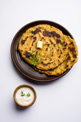 Thalipeeth is a type of savoury multi-grain pancake popular in Maharashtra, India served with curd/butter or ghee