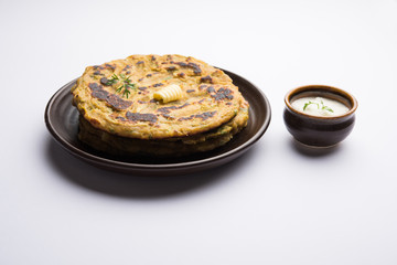 Thalipeeth is a type of savoury multi-grain pancake popular in Maharashtra, India served with curd/butter or ghee