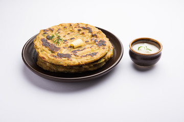 Thalipeeth is a type of savoury multi-grain pancake popular in Maharashtra, India served with curd/butter or ghee