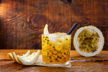 Passion Fruit Chairmanship of Brazil on wooden background. Mojitos cocktail, delicious summer drink