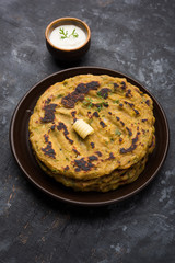 Thalipeeth is a type of savoury multi-grain pancake popular in Maharashtra, India served with curd/butter or ghee