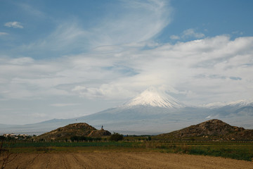Obraz premium Kevork Chavush monument on the background of Mount Ararat in Lusarat , Armenia.