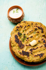 Thalipeeth is a type of savoury multi-grain pancake popular in Maharashtra, India served with curd/butter or ghee