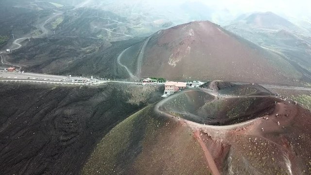 Aerial drone slowly rotating around the crater of the Etna vulcano near Catania in Sicily, Italy.