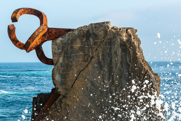 Fototapeta premium Waves with the Comb of the Wind as background, Donostia-San Sebastian, Spain