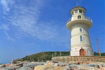 Old lighthouse in the harbor of the city of Antalya.