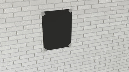 Blank black vertical poster taped to the brick wall